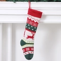 Calza di Natale a maglia con motivi di renne e fiocchi di neve in rosso e verde festoso - Stile Renna di Natale