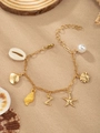 Golden ocean charm bracelet with starfish, seashells, and pearl pendants - Letter Z(Z)