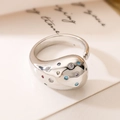 Artistic silver organic fluid ring with multi-colored cubic zirconia on a white card - Adjustable Open / Fluid Shape Silver (13969)