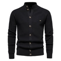 Close-up of black waffle knit cardigan texture with stand collar and button details - Black