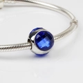 Silver snake chain bracelet featuring a faceted round blue crystal bead charm - Blue/06