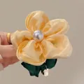 Elegant yellow satin flower hair tie with white faux pearl and dark green accents - Yellow Flower Scrunchie