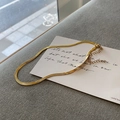 Detail view of golden snake chain necklace with lobster clasp and adjustable extension chain - 18K Gold Plated Single Layer Snake Bone Necklace