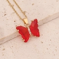 Elegant gold chain necklace with a translucent red butterfly pendant and tiny cubic zirconia - Red