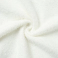 Macro detail of soft white faux fur fabric showing plush texture and fleece thickness - S / White (100% Nylon)