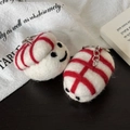 Handmade sushi-style wool felt keychains with smiling faces and red stripes on white - Sweet Shrimp Sushi