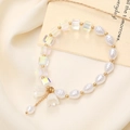 Elegant beaded bracelet with white pearls, iridescent cubes, and a floral charm detail - Lily of Valley Pearl Crystal Style (K3396)
