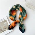 Dark green silk square scarf with orange floral pattern tied in a soft decorative knot - 70cm / Green Background Red Flower