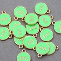Close-up of circular fluorescent green BFF pendants with gold trim for DIY jewelry - Fluorescent Green