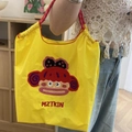 Bolso tote amarillo de nailon con cordón, bordado de mono y letras MZTKIN rojas - Mono de Boca Grande Amarillo