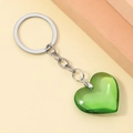Close-up of a translucent green 3D resin heart keychain with a silver metal ring and chain - Green