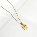 Detailed view of Sagittarius sign on rectangular hollow gold stainless steel pendant - Sagittarius