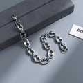 Detailed view of silver stainless steel interlocking geometric chain bracelet on grey background - gfaa321-Geometric Interlocking