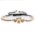 Detail of girl and double heart charm in gold finish with micro-pave zircons on braided cord - Girl + Multi-Color Bead Chain