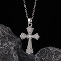 Macro shot of silver-plated cross pendant necklace with micro-pave cubic zirconia crystals - Style 26: Copper Plated With Real Gold + Stainless Steel Chain (color Retention)