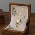 Gold titanium steel K-letter tassel necklace displayed in a premium wooden jewelry box - Letter K / Gold