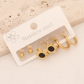 Detailed shot of three pairs of gold stainless steel earrings on a branded display card - 6# Flower