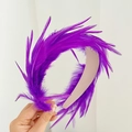 Detail of fluffy purple feather headband with vibrant textures and minimalist design - Purple Feather Headband