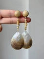 Macro shot of long drop earrings with natural stones and brown shells held by hand - 34# Silver Earring Post - Coffee AB Color (Natural Stone Shell Long)