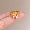 Adjustable gold butterfly ring with white pearls and small star-shaped accents - Pearl Star