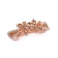 Detail of a golden metal hair clip with amber rhinestones in a double flower design - Style B / Champagne