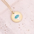 Close-up of golden evil eye charm necklace with blue enamel on natural stone background - 7# Lake Blue