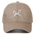 Detail of white bow embroidery on a khaki soft cotton baseball cap with ventilation eyelets - Khaki