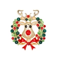 Close-up of a reindeer wreath brooch with red and green crystals on golden metal - Reindeer Wreath