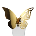 Detail of golden hollow butterfly decoration on glass rim for wedding table setting - Reflective Gold