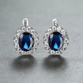 Elegant oval blue sapphire earrings with white diamond halo in silver plating - White Gold With Blue Zircon