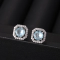 Elegant silver square stud earrings featuring a light blue round zircon and halo crystals - Light Blue Zircon