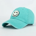 Lake blue washed cotton baseball cap featuring a plush smiley face embroidery patch - Lake Blue