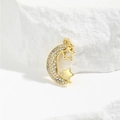 Macro detail of gold moon and star pendant with white cubic zirconia inlay on stone - Moon And Star Style (ZYN-DMK649G)
