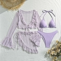 Flat lay detail of purple four-piece lace bikini set with matching cardigan and skirt - Light Purple