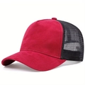 Close-up of red suede fabric and black breathable mesh on a classic trucker hat - Red