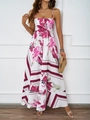 Sommerliches Maxikleid mit Blumenmuster in Pink und Neckholder-Ausschnitt am Modell - S / Weiß-Rosarot