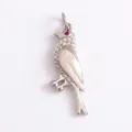 Exquisite silver bird pendant featuring a red gemstone eye and pavé diamond wings - Red-eye Bird-White Gold