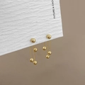 Elegant gold finish triple sphere tassel earrings with delicate metal chains on card - Gold Ball Chain Tassel