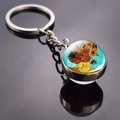 Silver metal keychain featuring Van Gogh Sunflowers art glass ball on reflective surface - Sunflowers in a Vase
