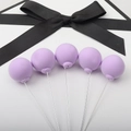Five matte purple balloon cake toppers with a black fabric bow on a clean white background - Single Piece / Light Purple Single Ball