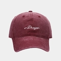 Macro shot of embroidered Dragon logo on vintage washed burgundy cotton baseball cap - Adjustable / Burgundy