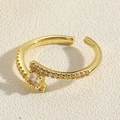 Detailed close-up of 14K gold plated bamboo ring with square zircon and micro-pavé accents - Crossed White Zirconia
