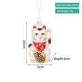 Detailed view of hand-painted glass lucky cat Christmas ornament with glitter accents - Fortune Cat