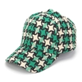 Dettaglio della trama pied-de-poule verde e nera su un cappello da baseball caldo - Verde