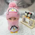 Pink knitted children's winter hat and scarf set featuring cartoon penguin patterns - Penguin Hat And Scarf Set Pink