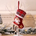 Red and black plaid Christmas stocking with a 3D Santa Claus and gold star detail - Santa Claus Doll Style