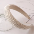 Close-up of a wide vintage headband with hand-beaded ivory pearls and soft lining - Style 1 (Creamy White Pave Pearl)