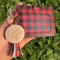 Detail of red and black buffalo plaid card holder with tassel and wood charm - Red Grid