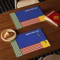 Waterproof leather placemat with blue and yellow geometric color block design and slogan - Premium Blue