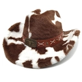 Close-up of fluffy cow print cowboy hat with brown leather band and bull head emblem - Straight Crown Coffee